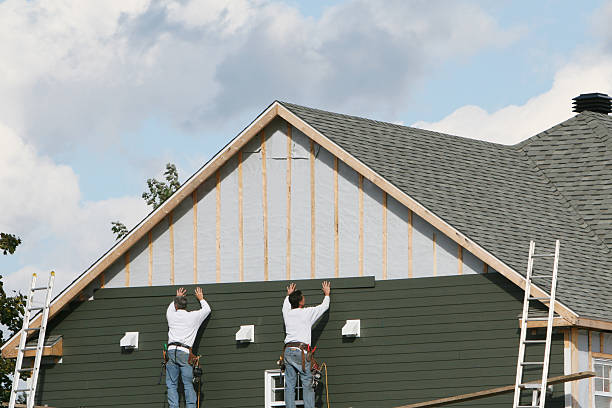 Professional Storm Damage Siding Repair technician working in Brentwood, PA